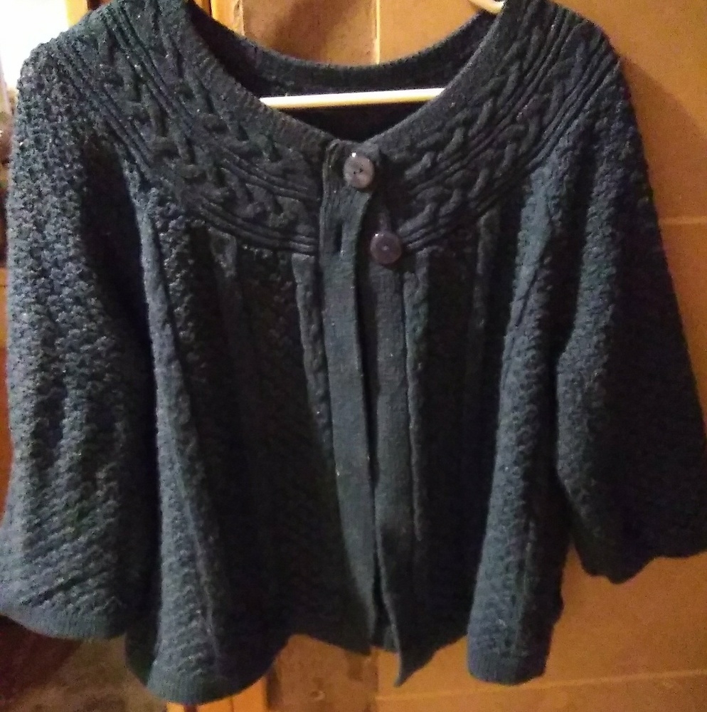 A turqouse cardigan